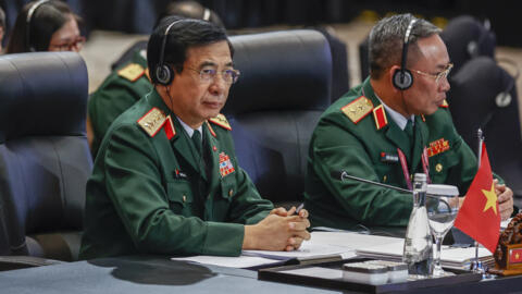 Vietnam's Defense Minister Phan Van Giang, left, attends the Association of Southeast Asian Nations (ASEAN) Defense Ministers Meeting in Jakarta, Indonesia, Wednesday, Nov. 15, 2023.