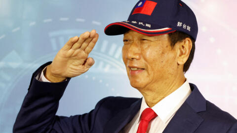 Terry Gou, founder of Taiwan's Foxconn poses for pictures while saluting during a news conference in Taoyuan, Taiwan April 5, 2023