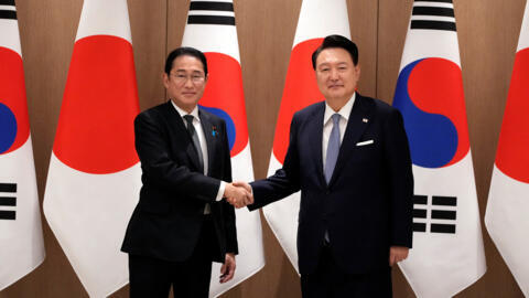 South Korean President Yoon Suk Yeol and Japanese Prime Minister Fumio Kishida shake hands during a meeting at the Presidential Office in Seoul, South Korea, Friday, Sept. 6, 2024.