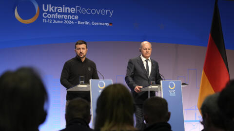 Ukrainian President Volodymyr Zelenskyy, left, and German Chancellor Olaf Scholz attend a press conference at the recovery conference in Berlin, Germany, Tuesday, June 11, 2024. Germany is hosting a conference to gather support for Ukraine's recovery from the destruction wreaked by Russia's war, sending a new signal of solidarity with Kyiv at the start of a week of intense diplomacy. (AP Photo/Ebrahim Noroozi)