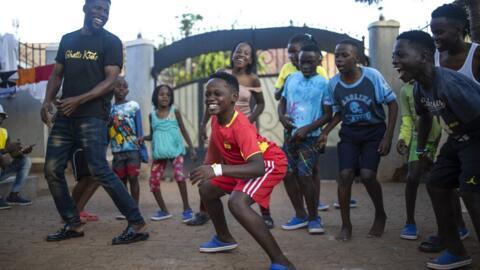 Akram Muyanja (C), 13, a member of the Ugandan dance group "the Ghetto Kids", practising dance routines in Kampala.