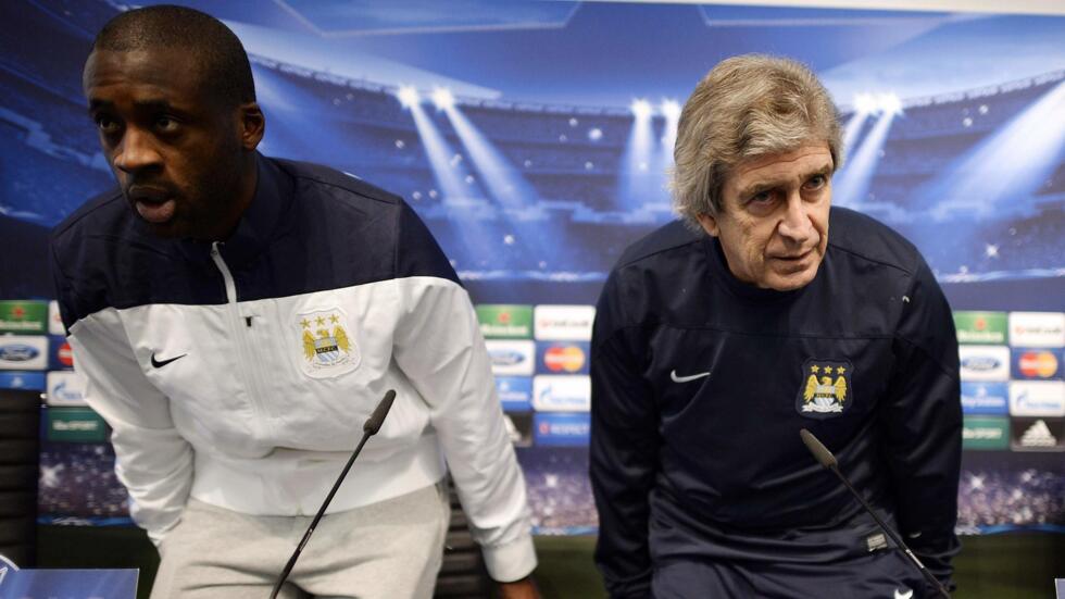 City boss Manuel Pellegrini (right) had tried to quell talk of his team romping to the English Premier League title.