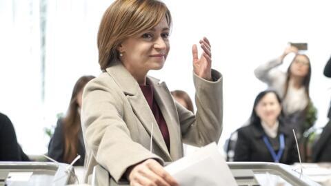 Moldova's President Maia Sandu prepares to cast her vote, in Chisinau, Moldova, Sunday, 20 October 2024, during a presidential election and a referendum on whether to enshrine in the Constitution the country's path to European Union membership. 