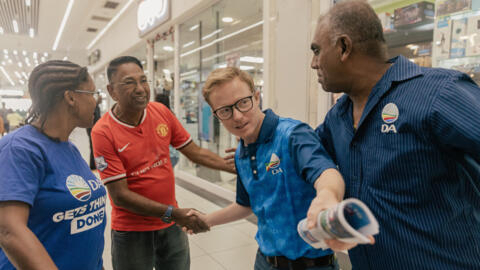 Democratic Alliance (DA) party's Chris Pappas, municipality mayor and KwaZulu Natal premier candidate, with a potential voter during the Democratic Alliance (DA) voter engagement walkabout at the Chatsworth Centre in Durban on 4 May 2024 ahead of the 2024 South African general elections.