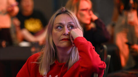 Supporters of Yes vote reacts after listening to the results at a "Yes2023 Official Referendum Function" in Sydney on October 14, 2023. The first polls have closed in Australia's bitterly fought referendum on Indigenous rights, with early results suggesting voters are set to reject reforms to the 122-year-old constitution. (Photo by Saeed KHAN / AFP)