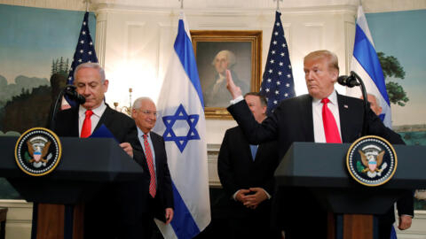 US President Donald Trump alongside Israel's Prime Minister Benjamin Netanyahu during a ceremony to sign a proclamation recognising Israel's sovereignty over the Golan Heights.