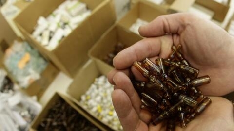 A police officer holds vials of blood-booster EPO and related drugs in the headquarters of Austria's special anti doping police task force in Vienna. Ancient Olympic dopers got their pre-Games hormone boost from chewing on raw animal testicles. The problem of some Olympic competitors taking potions, medicines and supplements to boost performance is as old as the Games themselves. 