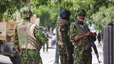 Kenyan police officers stand together during a joint operation with Haitian Police, in Port-au-Prince, Haiti 29 July, 2024. 