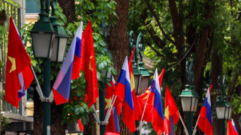 Vietnamese and Russian national flags decorate the street lamps near the Hotel Metropole Hanoi, where Russian President Vladimir Putin is expected to stay, ahead of his visit to Vietnam in Hanoi, Viet