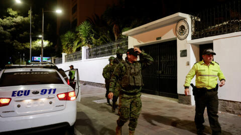 Police and military officials walk outside the Mexican embassy from where they forcibly removed the former Ecuador Vice President Jorge Glas in Quito, Ecuador April 5, 2024. REUTERS/Karen Toro