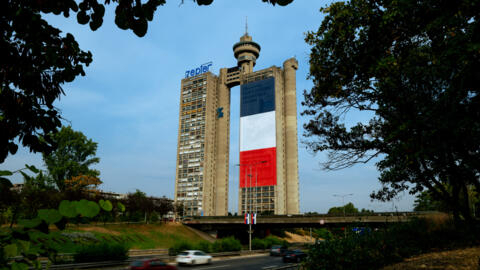 A giant French flag is displayed on one of Belgrade's landmark buildings, the Western City Gate, also known as the Genex Tower, two days before French President Emmanuel Macron's visit to Serbia, in Belgrade on 27 August, 2024.