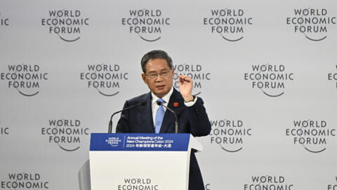 Chinese Premier Li Qiang delivers his speech during the opening ceremony of the World Economic Forum Annual Meeting of the New Champions (AMNC24) in Dalian, in China's northeastern Liaoning province,