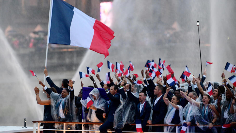 Athletes of France are seen on their boat at Pont d'Austrerlitz in the river Seine during the opening ceremony.