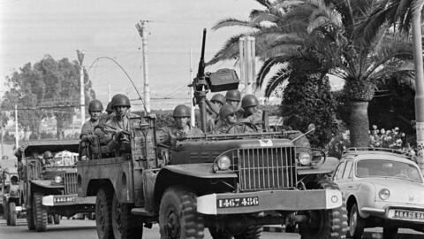 French soldiers patrol in a street of Algiers, during the Algeria war, 30 April 1962.