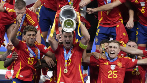 Spain skipper Alvaro Morata lifts the Euro 2024 trophy after his side's 2-1 victory over England.