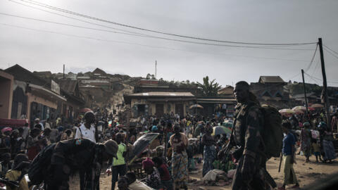 FARDC (Armed Forces of the DRC) soldiers patrol the Kanyabayonga market, North Kivu province, eastern Democratic Republic of Congo, on 14 May, 2024.