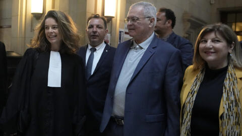 Obeida Dabbagh, brother of Mazen Dabbagh, and his wife Hanane (right) arrive at the Paris courtroom with their lawyer Clemence Bectarte (left) and Syrian lawyer Mazen Darwish, 21 May 2024.