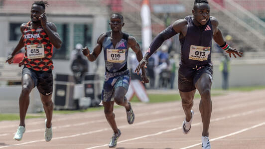 Kenyan 100m African record holder Ferdinand Omanyala crosses the finish line in the 100m men's final during the Kenya Athletics 2024 Paris Olympic Trials at the Nyayo National Stadium in Nairobi, on 15 June 2024.