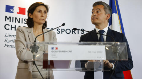 French Sports Minister Amélie Oudéa-Castéra, left, and Interior Minister Gerald Darmanin attend a press conference following incidents during the Champions League final at the Stade France stadium on, 30 May, 2022.