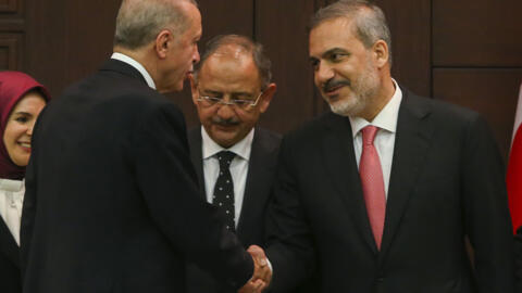 Turkey's Foreign Minister Hakan Fidan shakes hands with President Recep Tayyip Erdogan during his inauguration ceremony at the presidential complex in Ankara, Turkey, Saturday, 3 June, 2023. 