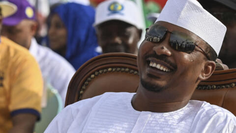 Chad's transitional president Mahamat Idriss Deby Itno reacts as he sits in the Place des Nations during final presidential election campaign rally, in N'Djamena on 4 May, 2024. 