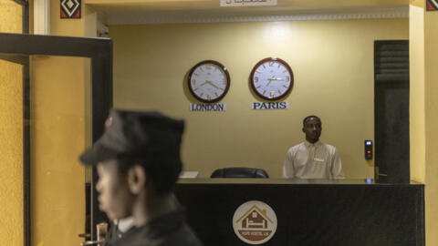 Staff stand at the reception at Hope Hostel, which is getting ready to host asylum seekers deported from the United Kingdom, in Kigali, Rwanda, on 24 April 2024.