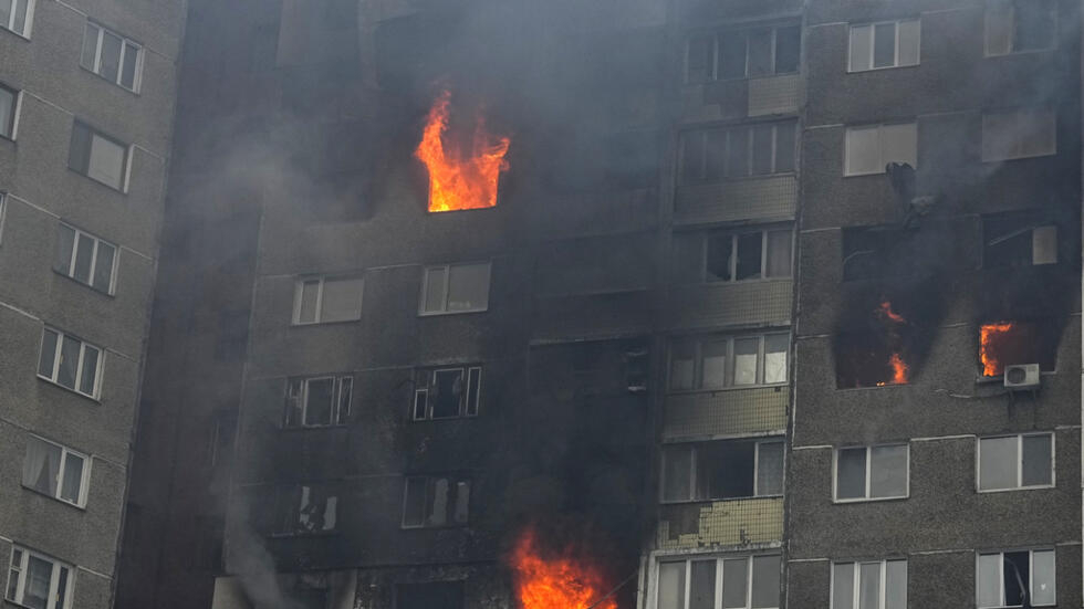 Fire and smoke rise out of an apartment building after Russian attack in Kyiv, Ukraine, Wednesday, Feb. 7, 2024. Authorities say Russia has fired cruise and ballistic missiles and Shahed-type drones a