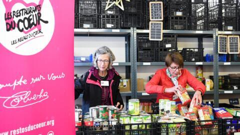 Volunteers prepare food packages in Asnieres, northern Paris, for the launch of the Restos du coeur winter campaign in November 2022. 