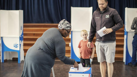 A woman casts her ballot at the Northwood School polling station in Durban, on 29 May 2024, during South Africa's general elections.