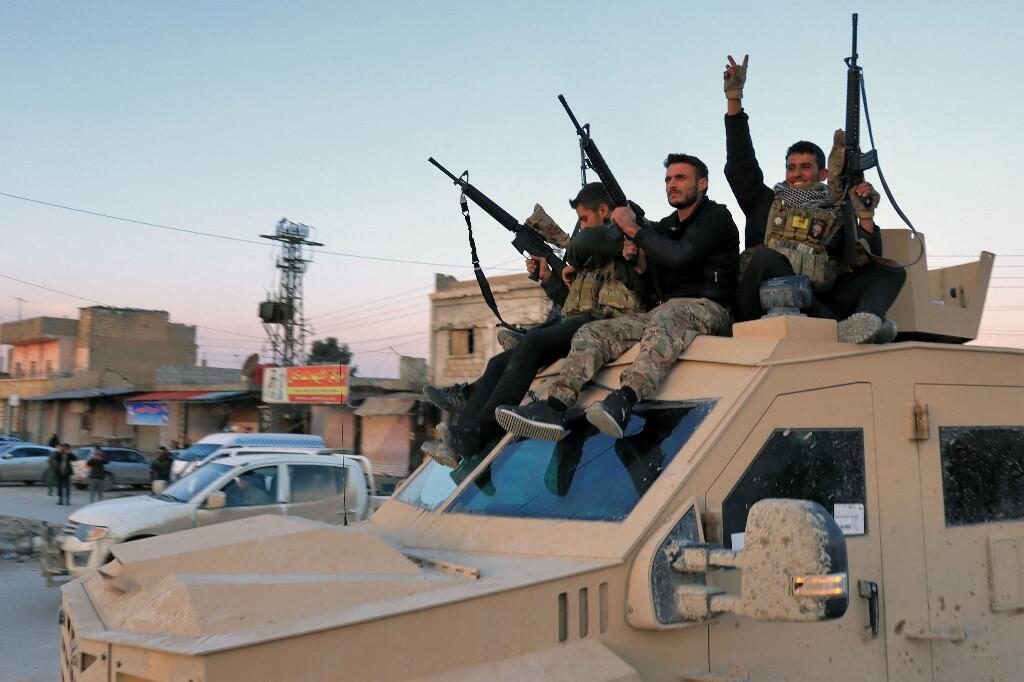 Members of the Syrian Democratic Forces (SDF) deploy outside Ghwayran prison in Syria's northeastern city of Hasakeh in early January, 2022, after having declared over the facility following its takeover by Islamic State (IS) group forces. - Kurdish forces on January 26 retook full control of the prison in northeast Syria where Islamic State group jihadists had been holed up since attacking it six days earlier. The brazen IS jailbreak attempt and ensuing clashes left more than 180 dead in the jihadists' most high-profile military operation since the loss of their "caliphate" nearly four years ago.