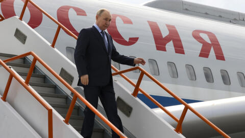 Russian President Vladimir Putin goes down the stairs upon his arrival at the airport of Yakutsk, republic of Sakha also known as Yakutia, Russia Far East, Russia, Tuesd