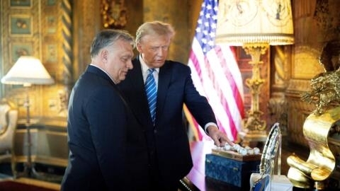 This handout photograph taken and released on March 8, 2024, by the Press Office of the Hungarian Prime Minister, shows Hungarian Prime Minister Viktor Orban (L) and former US President and Republican presidential candidate, Donald Trump during their meeting at Trump's Mar-a-Lago residence in Palm Beach, Florida