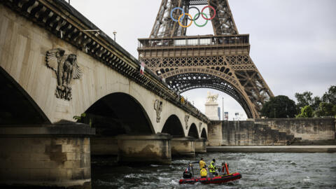 A rescue boat cruises on the Seine river during a rehearsal for the Paris 2024 Olympic Games opening ceremony, on 17 June 2024.