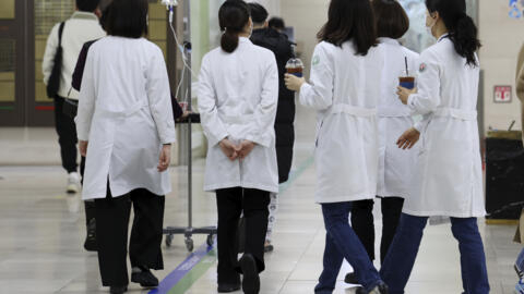 Medical workers walk inside a general hospital in Gwangju, South Korea, Monday, Feb. 19, 2024.  Trainee doctors in South Korea began resigning en masse Monday in protest of a government medical policy