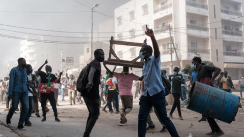 Protesters clash with police on the sidelines of a protest against a last-minute delay of presidential elections, in Dakar, Senegal, on February 9, 2024.