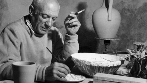 Pablo Picasso works on a ceramic piece in his workshop in Vallauris, southern France, in April 1949.