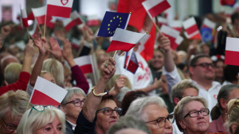 Supporters of Poland's largest opposition group, Civic Coalition, attend a meeting addressed by leader Donald Tusk in Lodz, Poland, 10 October, 2023. 