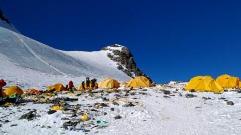 Discarded climbing equipment and rubbish scattered around Camp 4 of Mount Everest, where decades of commercial mountaineering have left a trail of discarded waste.