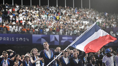 Paris 2024 Paralympics - Opening Ceremony - Paris, France - August 28, 2024 France's paralympic flag bearers Nantenin Keita and Alexis Hanquinquant lead the France's delegation during the Parade of Na