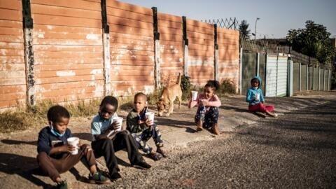 Children receiving free breakfasts in Johannesburg, South Africa, on 23 May 2020.