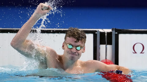 Leon Marchand, of France, celebrates after winning the men's 200-meter breaststroke final at the 2024 Summer Olympics, Wednesday, July 31, 2024, in Nanterre, France.