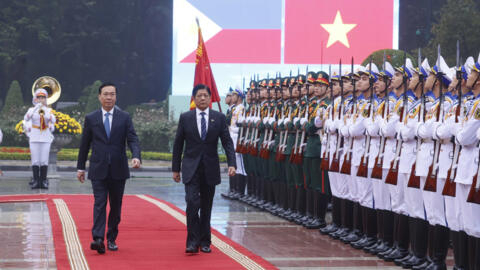 FILE - Philippine President Ferdinand Marcos Jr., right, and Vietnamese President Vo Van Thuong inspect honor guards during a welcome ceremony in Hanoi, Vietnam Tuesday, Jan. 30, 2024.