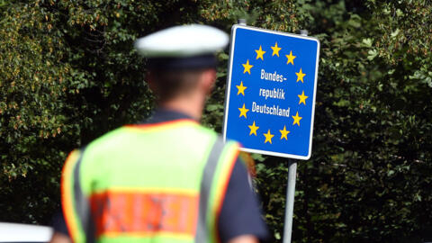 Bavarian Police Officers control cars at a checkpoint on the motorway between the Austrian and German border in Freilassing, Germany.