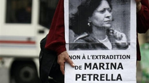 A demonstrator holds an image of Marina Petrella, former member of Italian armed gropu the Red Brigades, at a demonstration against her extradition in Paris in 2008. Patrella was one of seven Italian fugitives arrested in France on extradition requests from Rome, 28 April 2021.