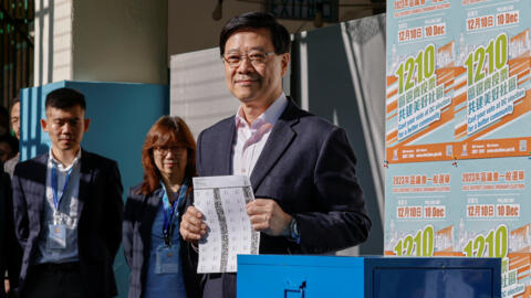 Hong Kong Chief ExecutiveÂ John Lee votes at a polling station during the District Council electionÂ in Hong Kong, China, December 10, 2023. REUTERS/Tyrone Siu