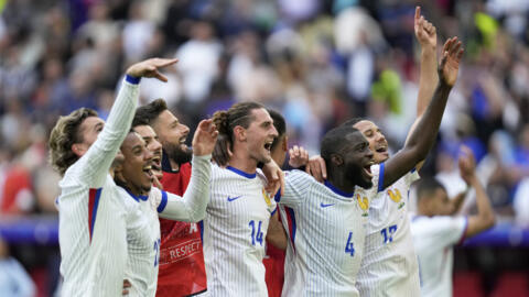 France players celebrate at the end of a round of sixteen match between France and Belgium at the Euro 2024 soccer tournament in Duesseldorf, Germany, Monday, July 1, 2024