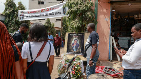 Mourners gather in the courtyard of Radio Amplitude FM, during a tribute to its director and journalist Martinez Zogo on 23 January, 2023, the day after his death was announced. 
