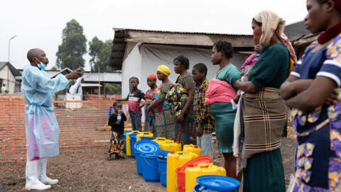 Heritier Bwira, a Congolese health worker guides relatives and patients discharged on the hygienic measures to follow after recovering from Mpox - an infectious disease caused by the monkeypox virus t