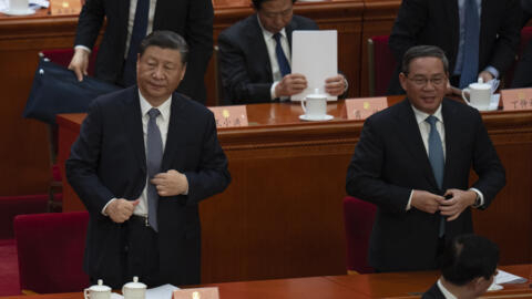 2024 年 3 月 4 日星期一，北京人民大会堂，中国国家主席习近平和中国国务院总理李强在中国人民政治协商会议开幕式后准备离开。