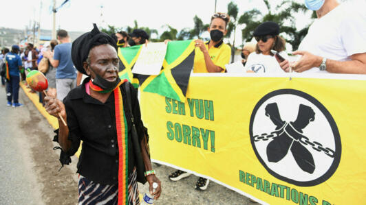 People calling for slavery reparations protesting outside the entrance of the British High Commission during the visit of the Duke and Duchess of Cambridge in Kingston, Jamaica on 22 March 2022.